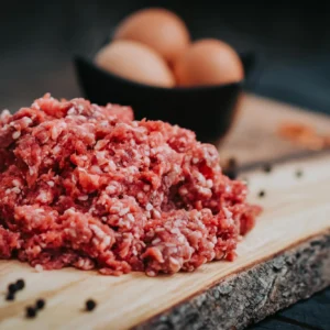Fresh ground beef from Pure Valley Farms on a wooden board