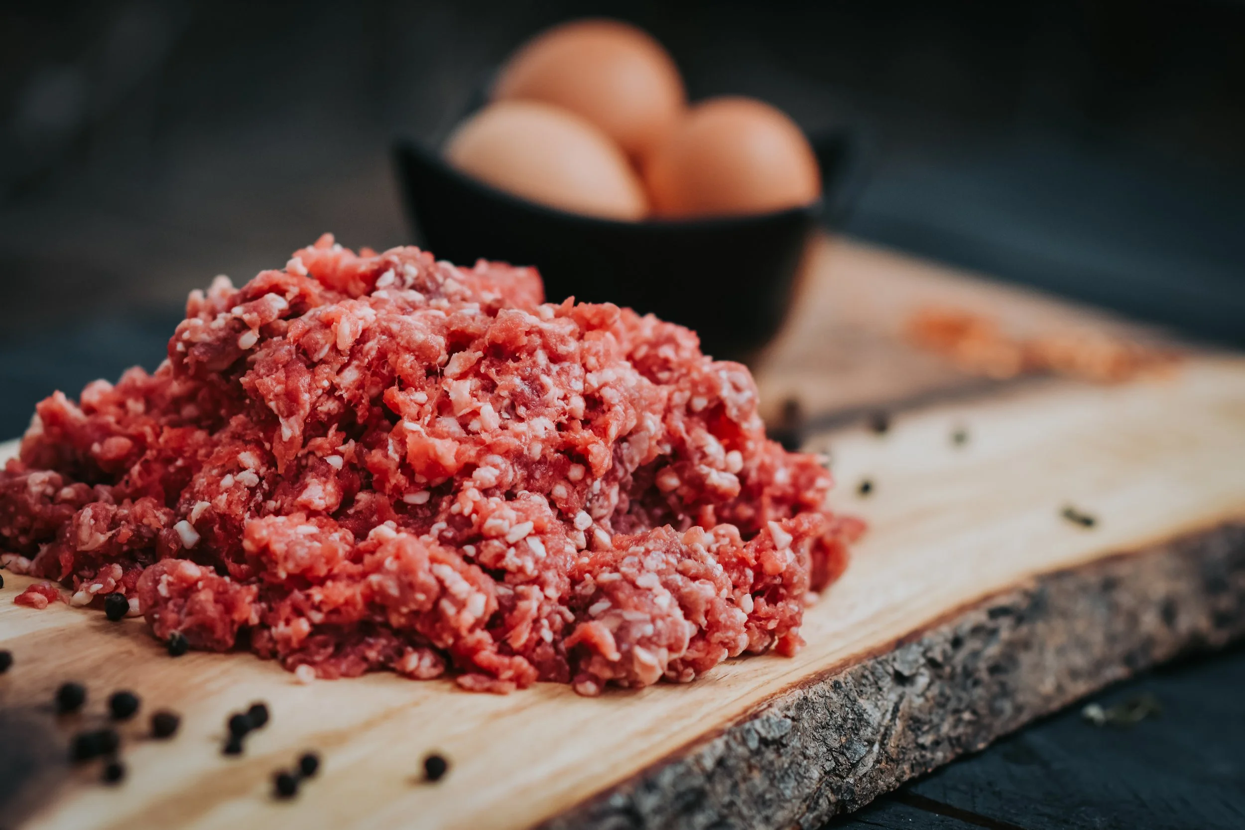 Fresh ground beef from Pure Valley Farms on a wooden board